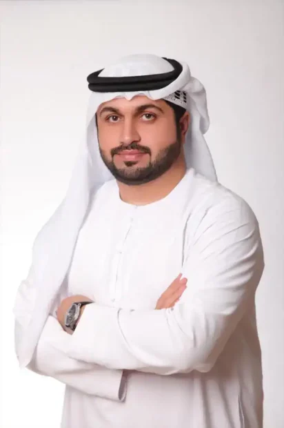 Professional Middle Eastern Man. Arab businessman wearing traditional attire, white kandura and ghutra, smiling confidently.