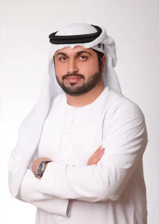 Professional Middle Eastern Man. Arab businessman wearing traditional attire, white kandura and ghutra, smiling confidently.